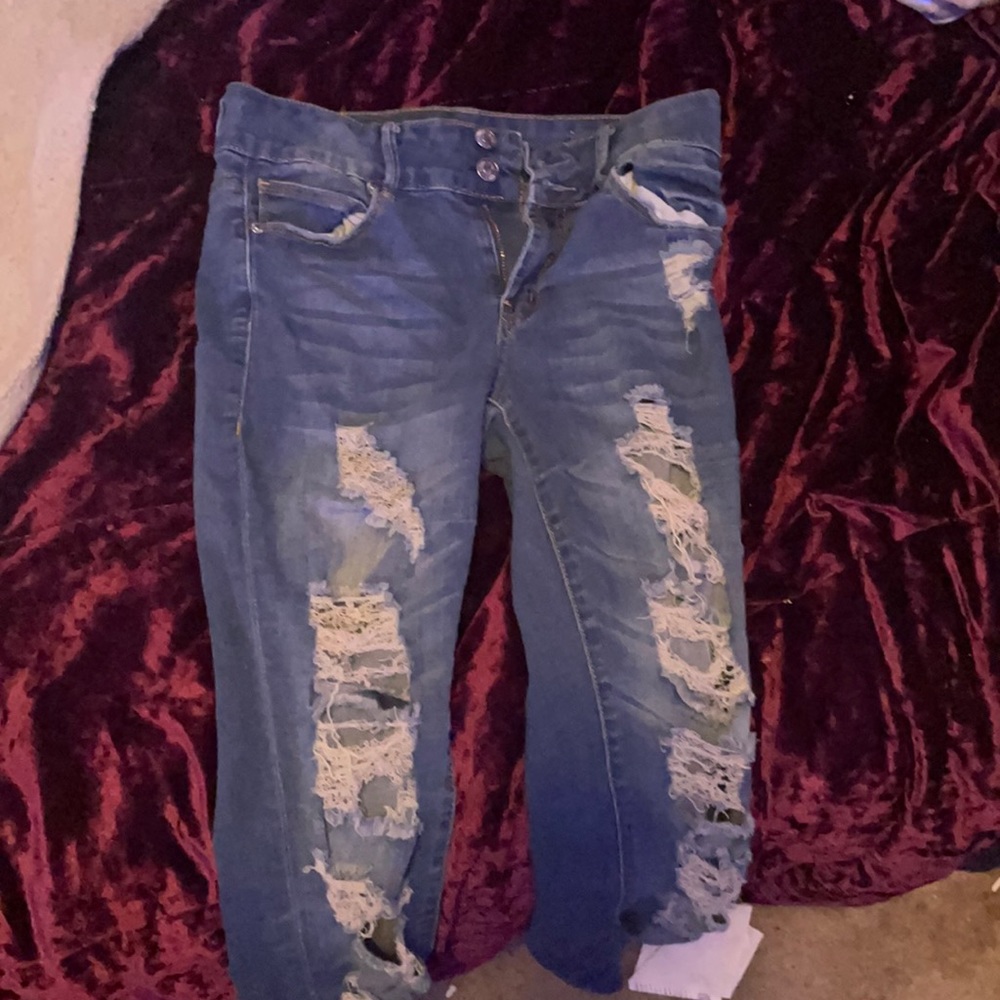 Blue Jeans with rips in them they are not new but only been worn once or twice